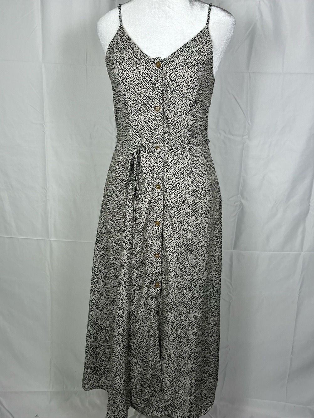 Sienna Sky sleeveless button-up maxi dress with belted waist.